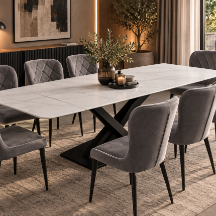 Large grey marble effect extending ceramic dining table with rounded ends and black sculptural pedestal base