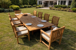 Teak outdoor dining table with 10 chairs on garden patio